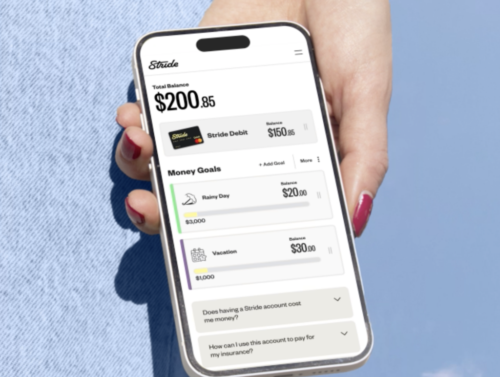 a hand holding a phone with savings account app