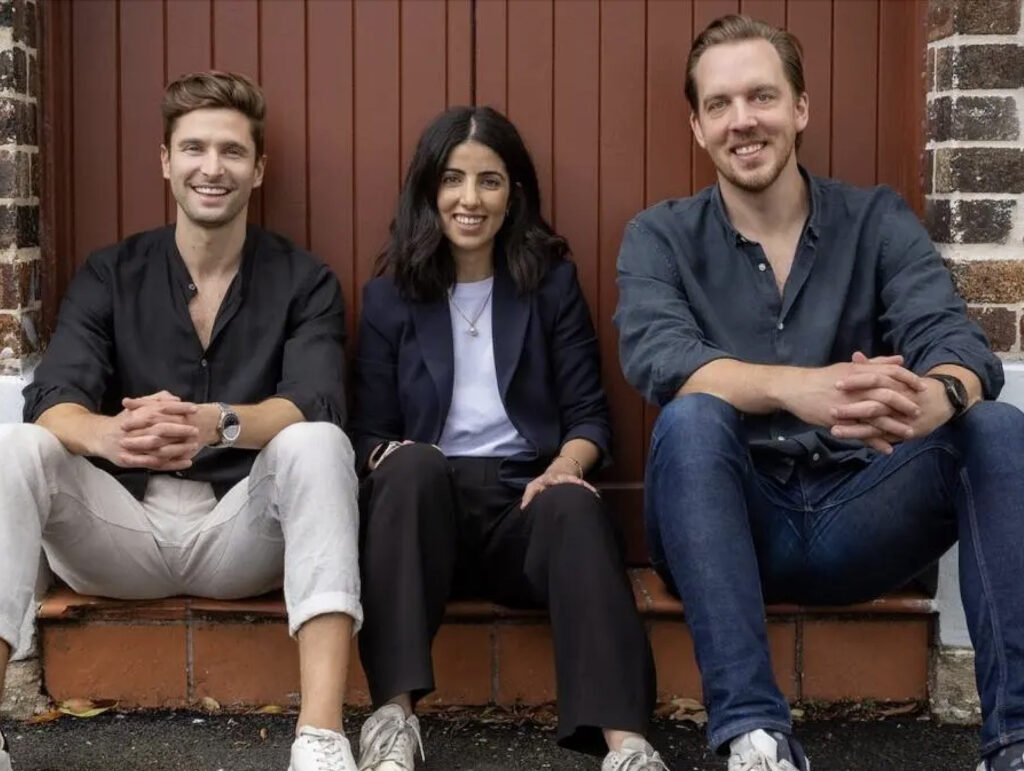 Safewill leadership team sitting against a wall